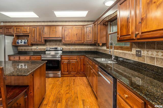 17937 Caplinger Pond Road Marion, IL 62959 - Photo 18 of 43 a kitchen with stainless steel appliances granite countertop a sink stove and cabinets