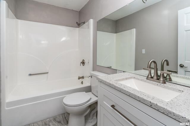 17937 Caplinger Pond Road Marion, IL 62959 - Photo 36 of 43 a bathroom with a granite countertop sink a toilet and a mirror
