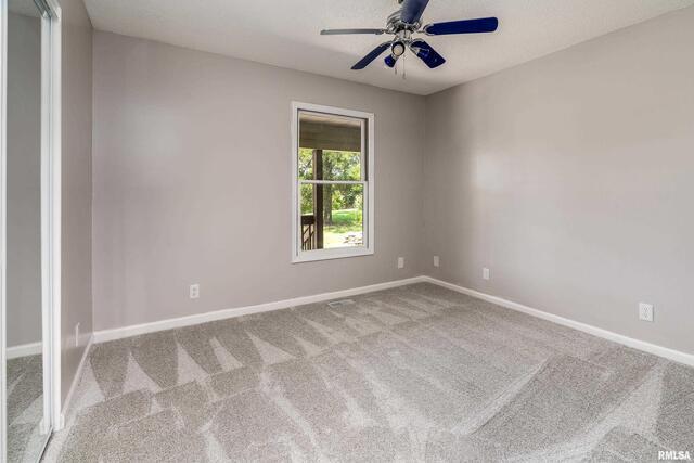 17937 Caplinger Pond Road Marion, IL 62959 - Photo 38 of 43 an empty room with windows and fan