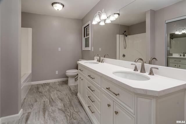 17937 Caplinger Pond Road Marion, IL 62959 - Photo 41 of 43 a bathroom with a sink double vanity and a toilet