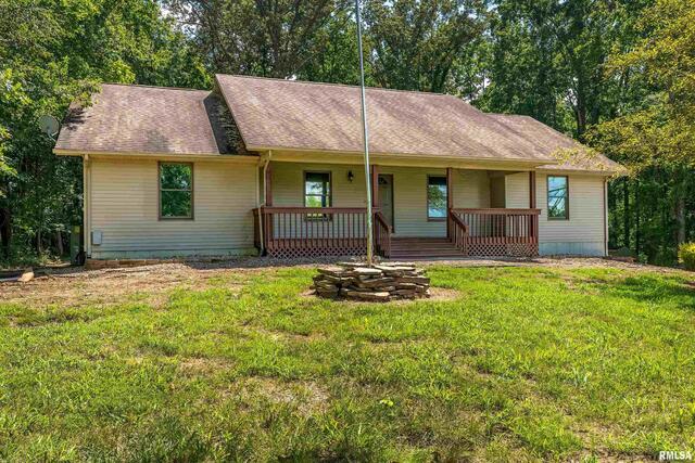 17937 Caplinger Pond Road Marion, IL 62959 - Photo 8 of 43 a backyard of a house with seating space