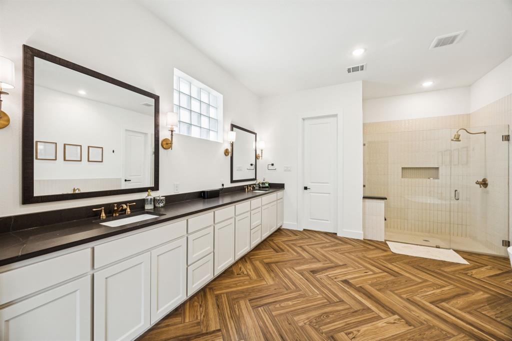 2429 Gallant Fox Road Celina, TX 75009 - Photo 14 of 39 a spacious bathroom with a double vanity sink and a mirror