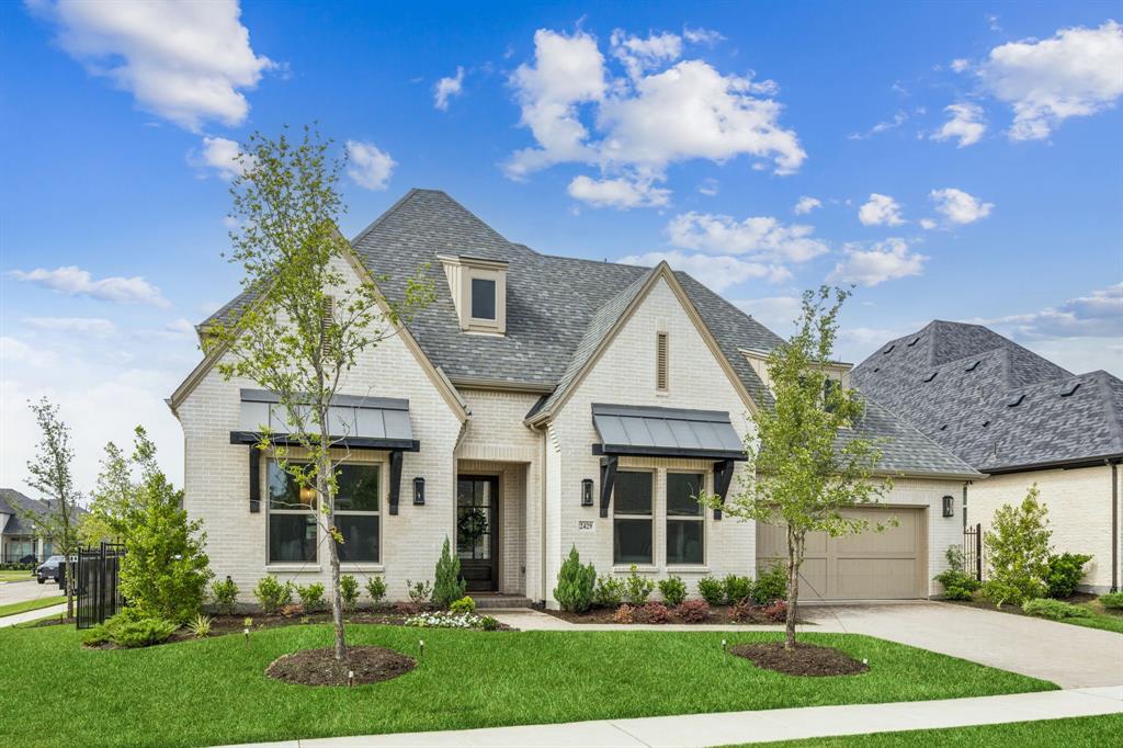 2429 Gallant Fox Road Celina, TX 75009 - Photo 2 of 39 a front view of a house with garden