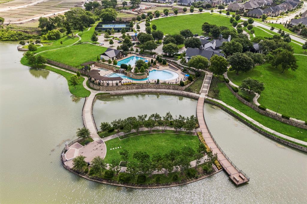 2429 Gallant Fox Road Celina, TX 75009 - Photo 38 of 39 a view of a swimming pool with a yard and plants