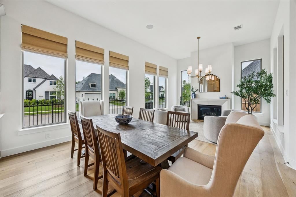 2429 Gallant Fox Road Celina, TX 75009 - Photo 9 of 39 a view of a dining room with furniture window and wooden floor