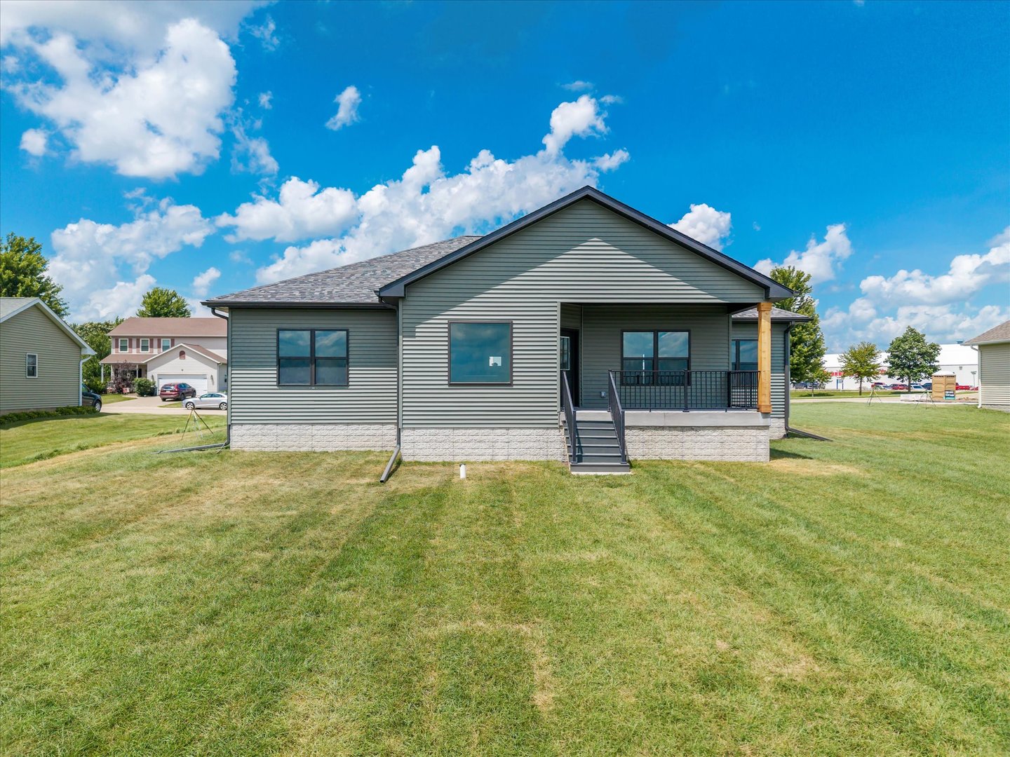 455 Rhonda Road New Liberty, IA 52765 - Photo 4 of 54 a house view with a garden space