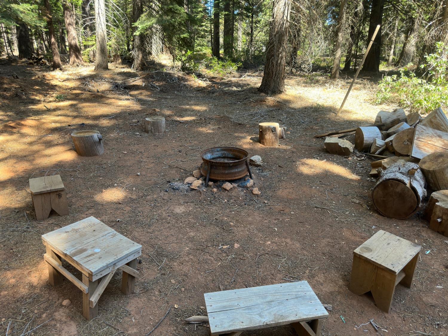 16023 Ophir Silver Road Nevada City, CA 95959 - Photo 1 of 1 a backyard of a house with table and chairs