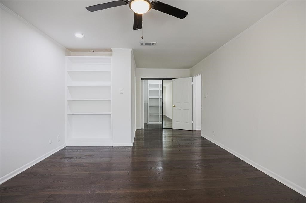 5614 Indian Circle Houston, TX 77056 - Photo 21 of 28 a view of an empty room with a window and wooden floor