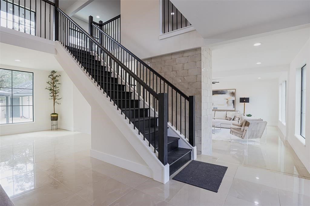 5614 Indian Circle Houston, TX 77056 - Photo 5 of 28 a view of staircase with white walls and windows