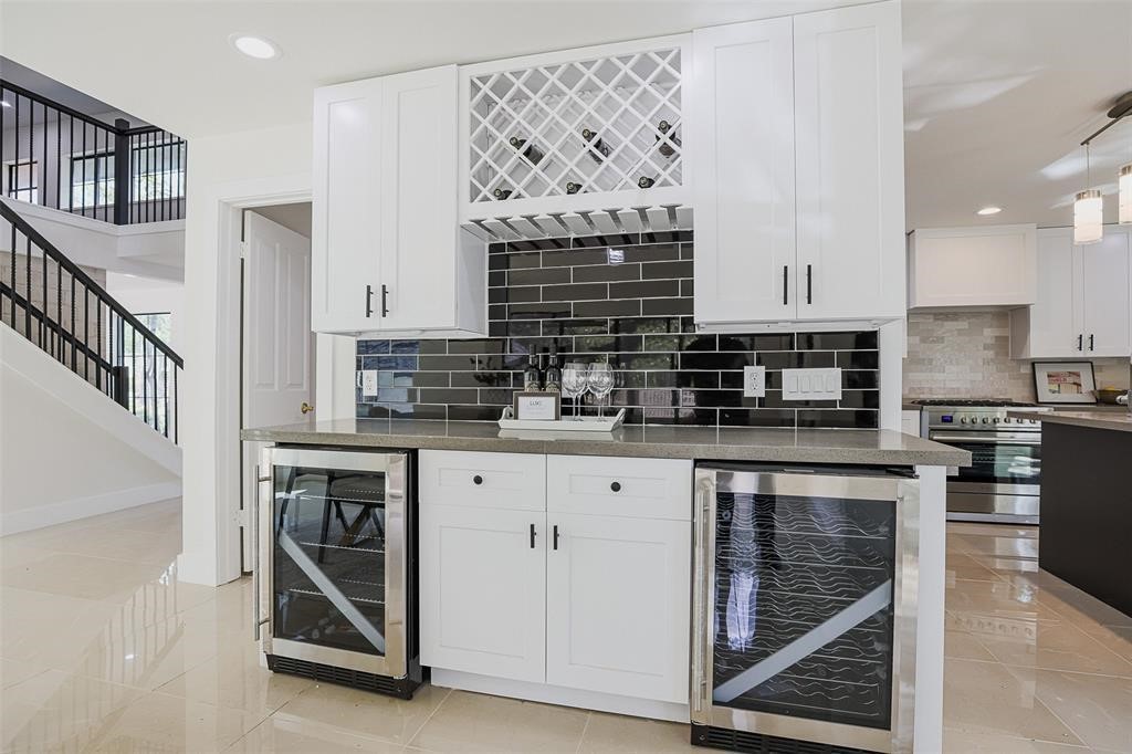 5614 Indian Circle Houston, TX 77056 - Photo 8 of 28 a kitchen with stainless steel appliances granite countertop a stove sink and cabinets