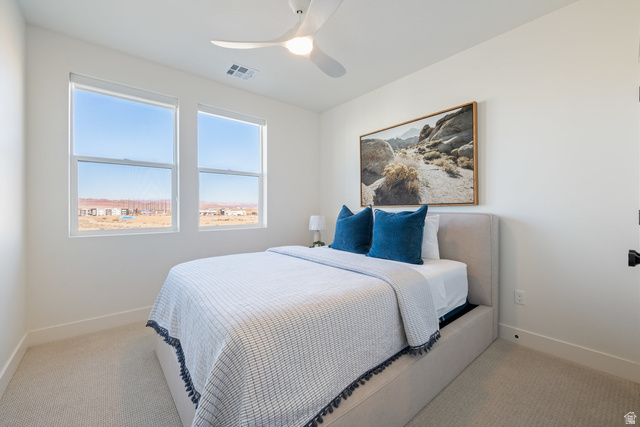 762 West Periwinkle Lane, Unit 102 St. George, UT 84790 - Photo 19 of 40 Bedroom featuring ceiling fan and light carpet