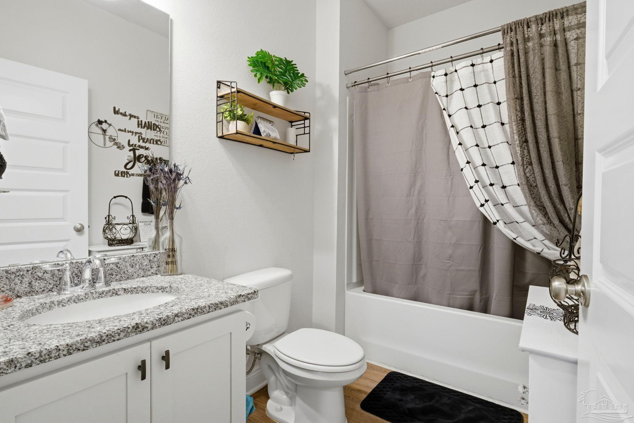 7829 Burnside Loop Pensacola, FL 32526 - Photo 15 of 34 a bathroom with a granite countertop sink toilet and shower