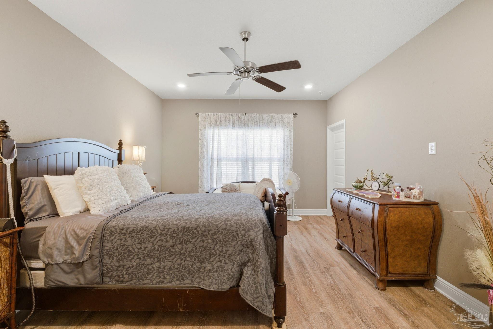 7829 Burnside Loop Pensacola, FL 32526 - Photo 20 of 34 a bedroom with bed and window