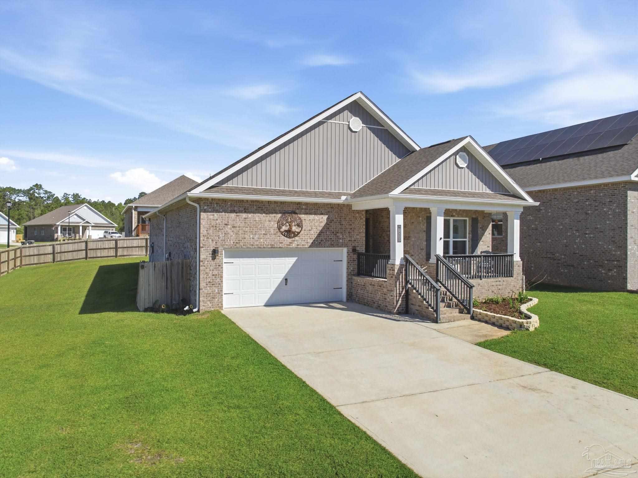 7829 Burnside Loop Pensacola, FL 32526 - Photo 2 of 34 a front view of house with yard and green space