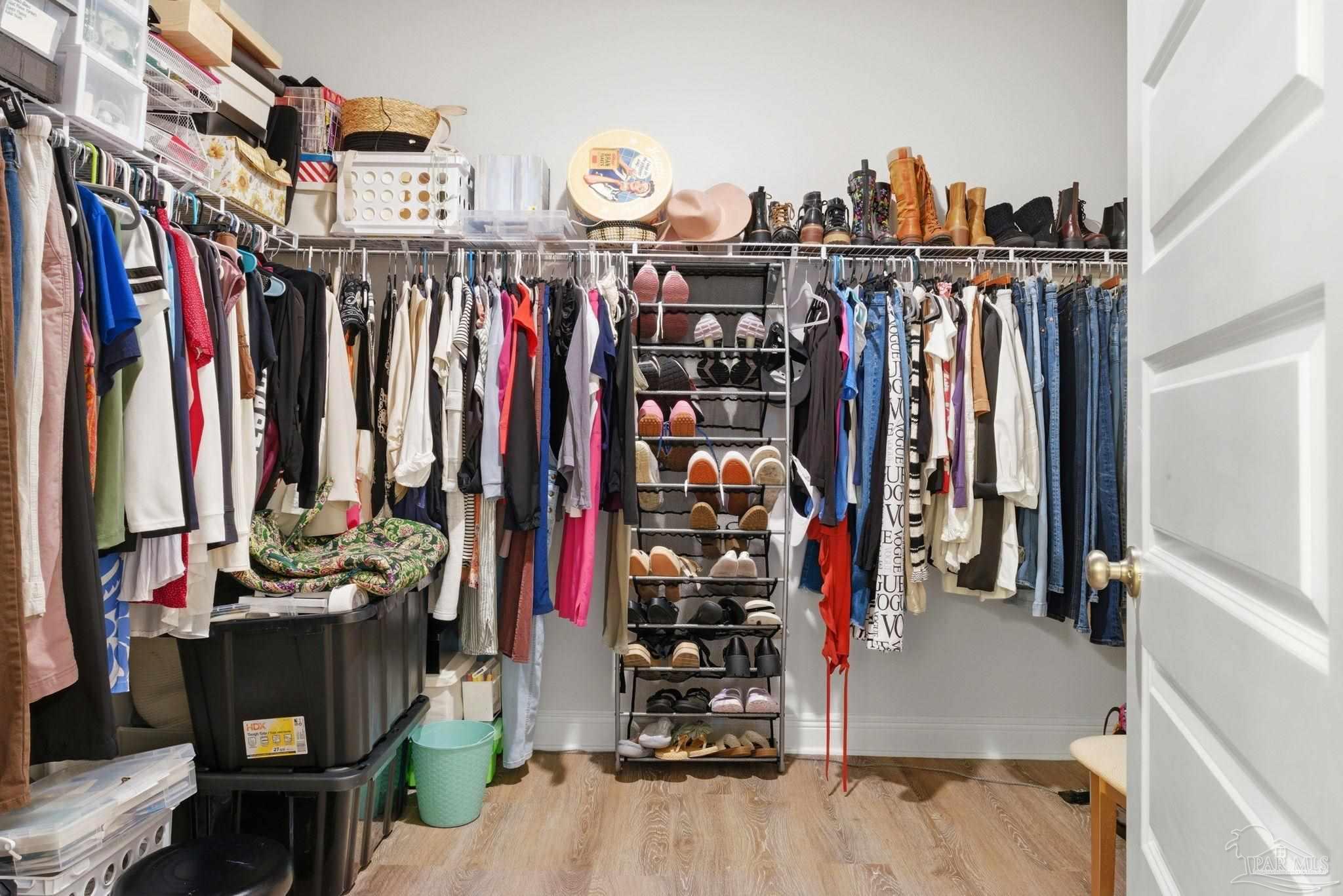 7829 Burnside Loop Pensacola, FL 32526 - Photo 23 of 34 a view of walk in closet with clothes