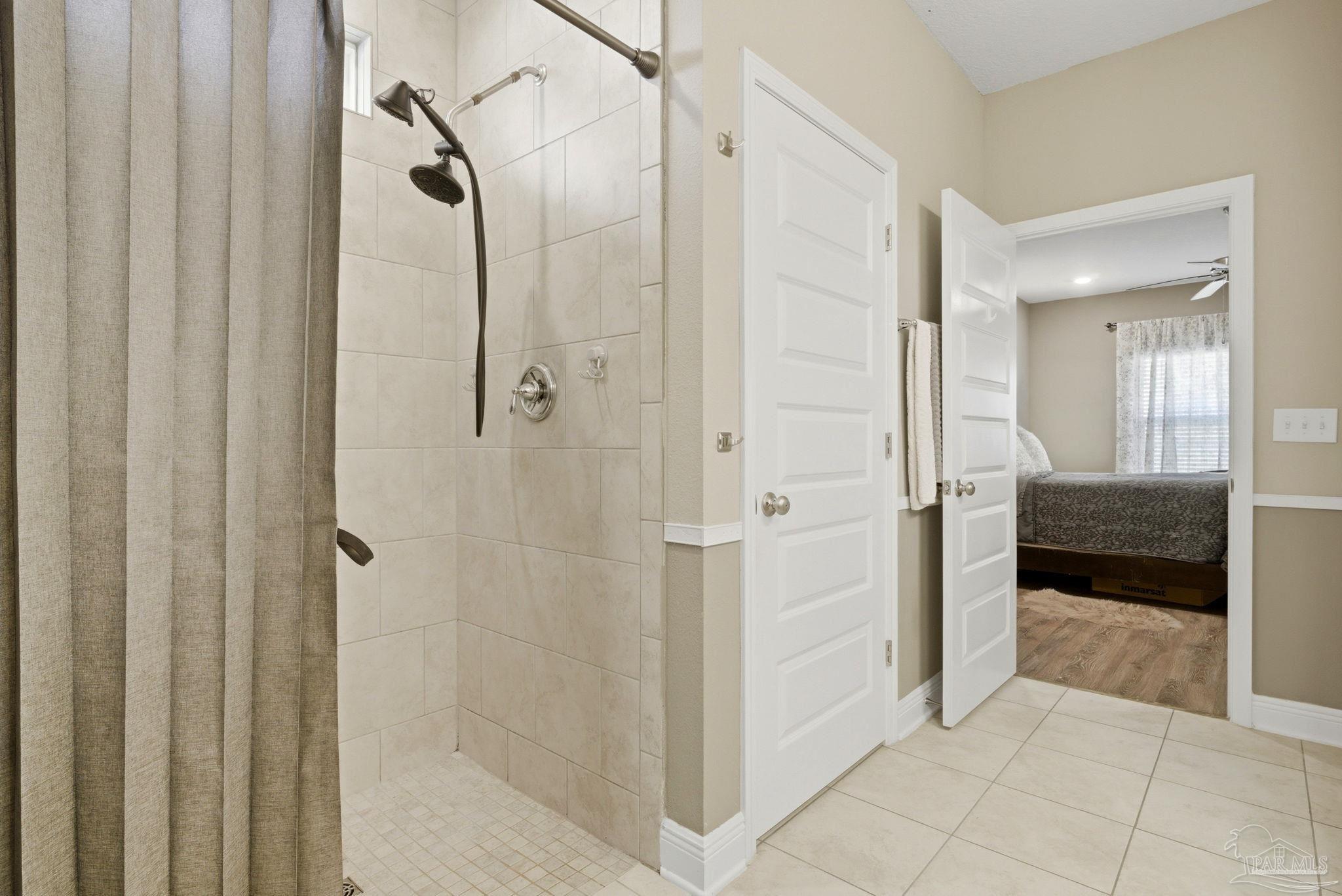 7829 Burnside Loop Pensacola, FL 32526 - Photo 24 of 34 a bathroom with a tub and shower