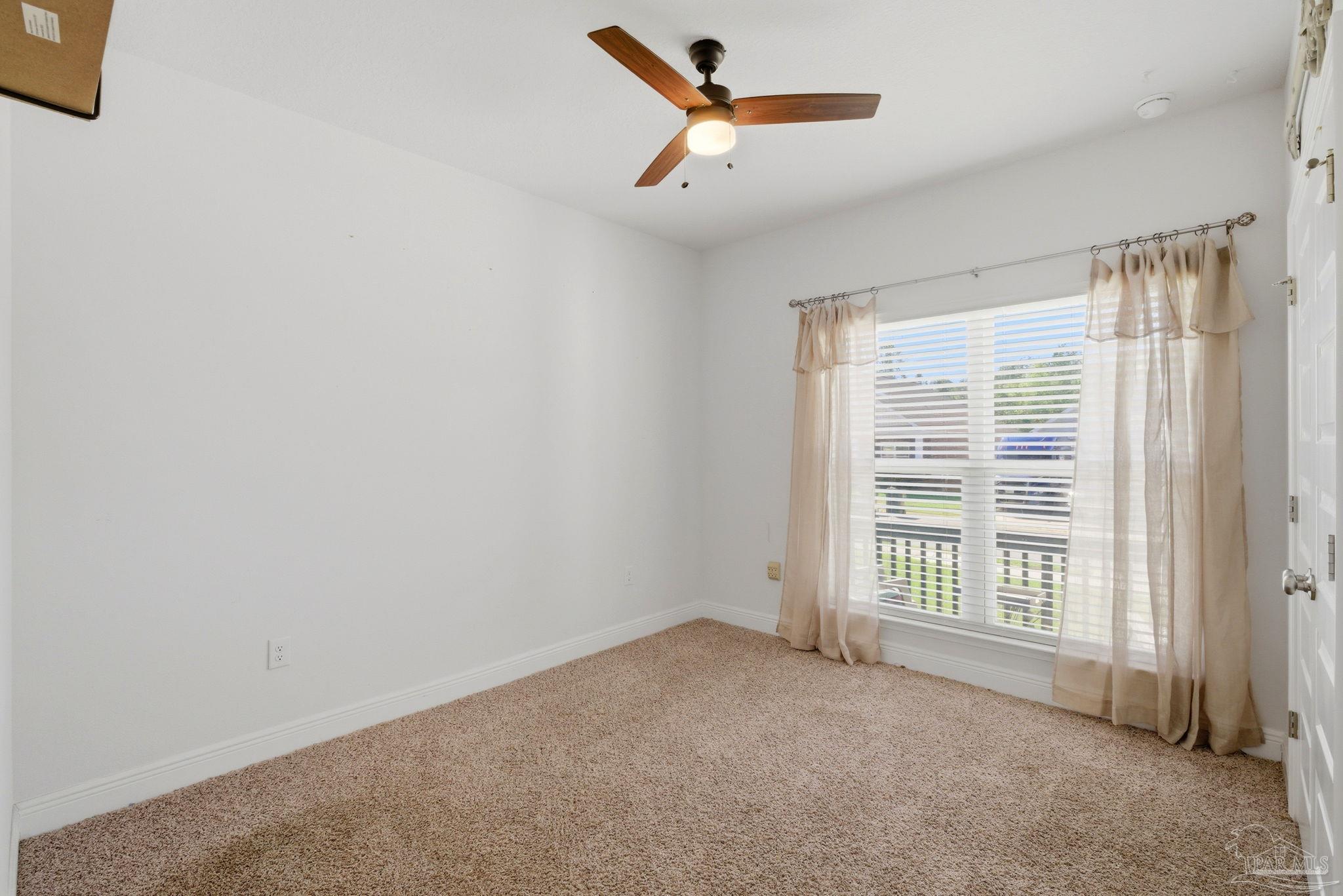 7829 Burnside Loop Pensacola, FL 32526 - Photo 25 of 34 a view of a livingroom with a ceiling fan and window