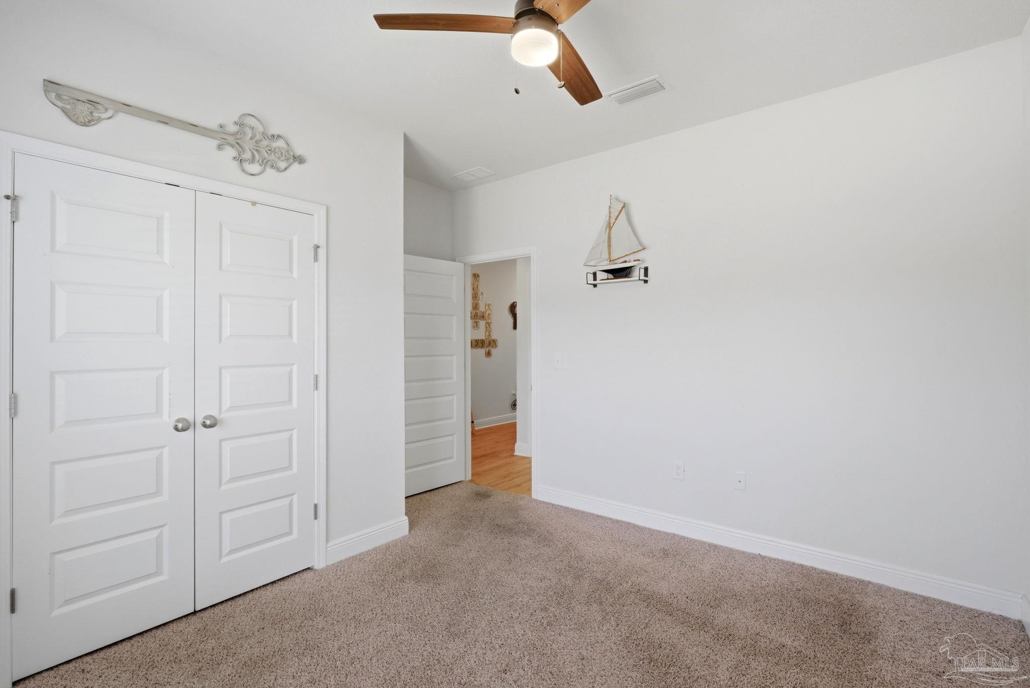 7829 Burnside Loop Pensacola, FL 32526 - Photo 26 of 34 wooden floor in an empty room