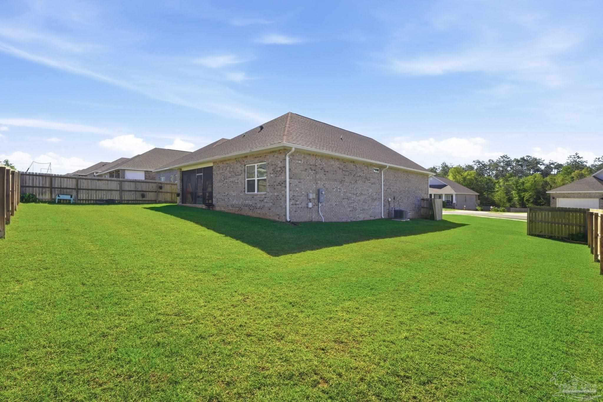 7829 Burnside Loop Pensacola, FL 32526 - Photo 30 of 34 a view of a house with a yard and sitting area