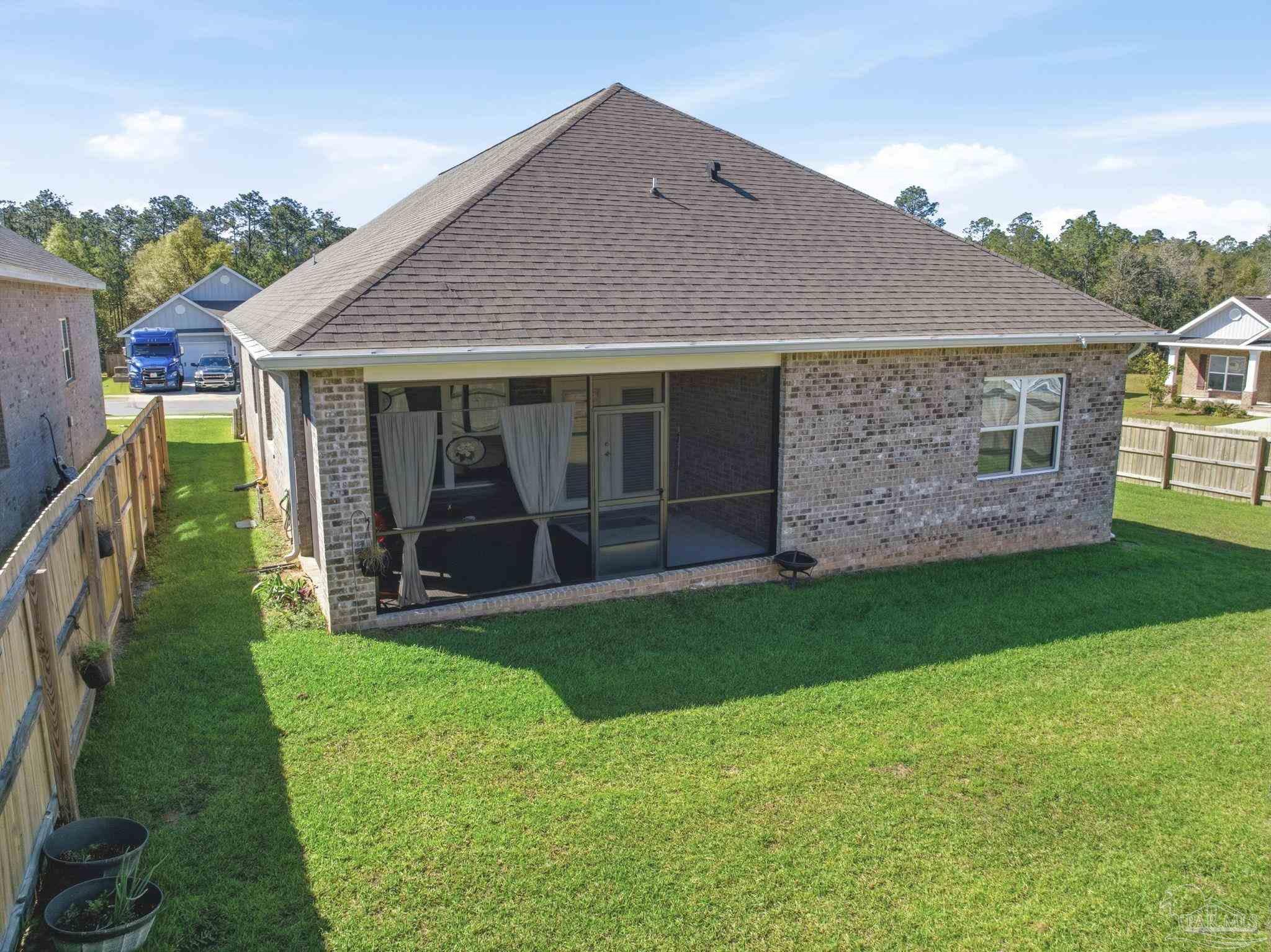 7829 Burnside Loop Pensacola, FL 32526 - Photo 33 of 34 a view of a house with backyard and porch
