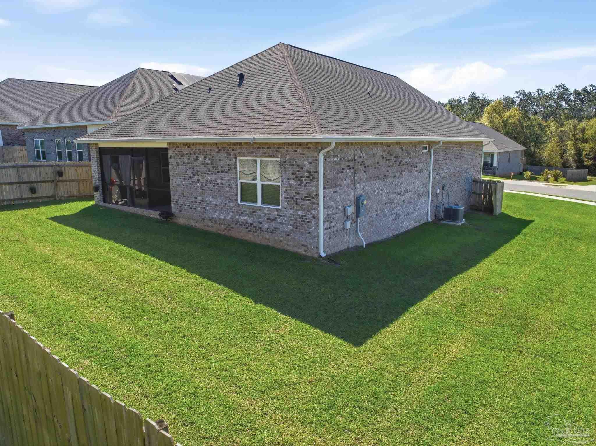 7829 Burnside Loop Pensacola, FL 32526 - Photo 34 of 34 a front view of a house with a garden