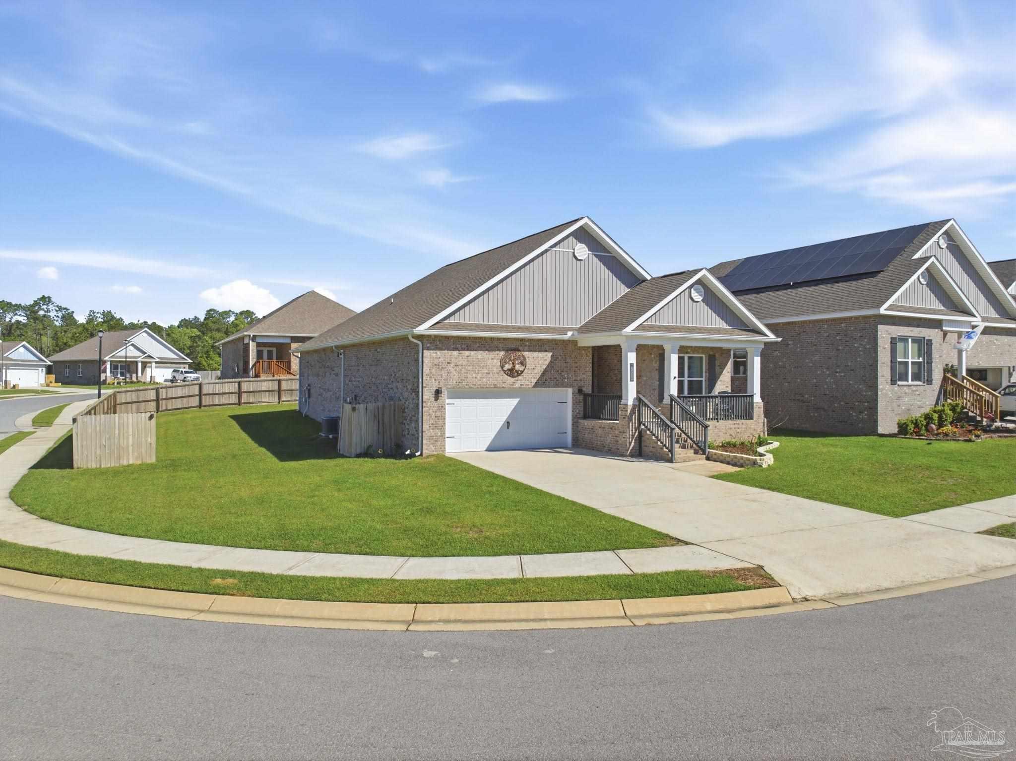 7829 Burnside Loop Pensacola, FL 32526 - Photo 4 of 34 a front view of a house with a yard