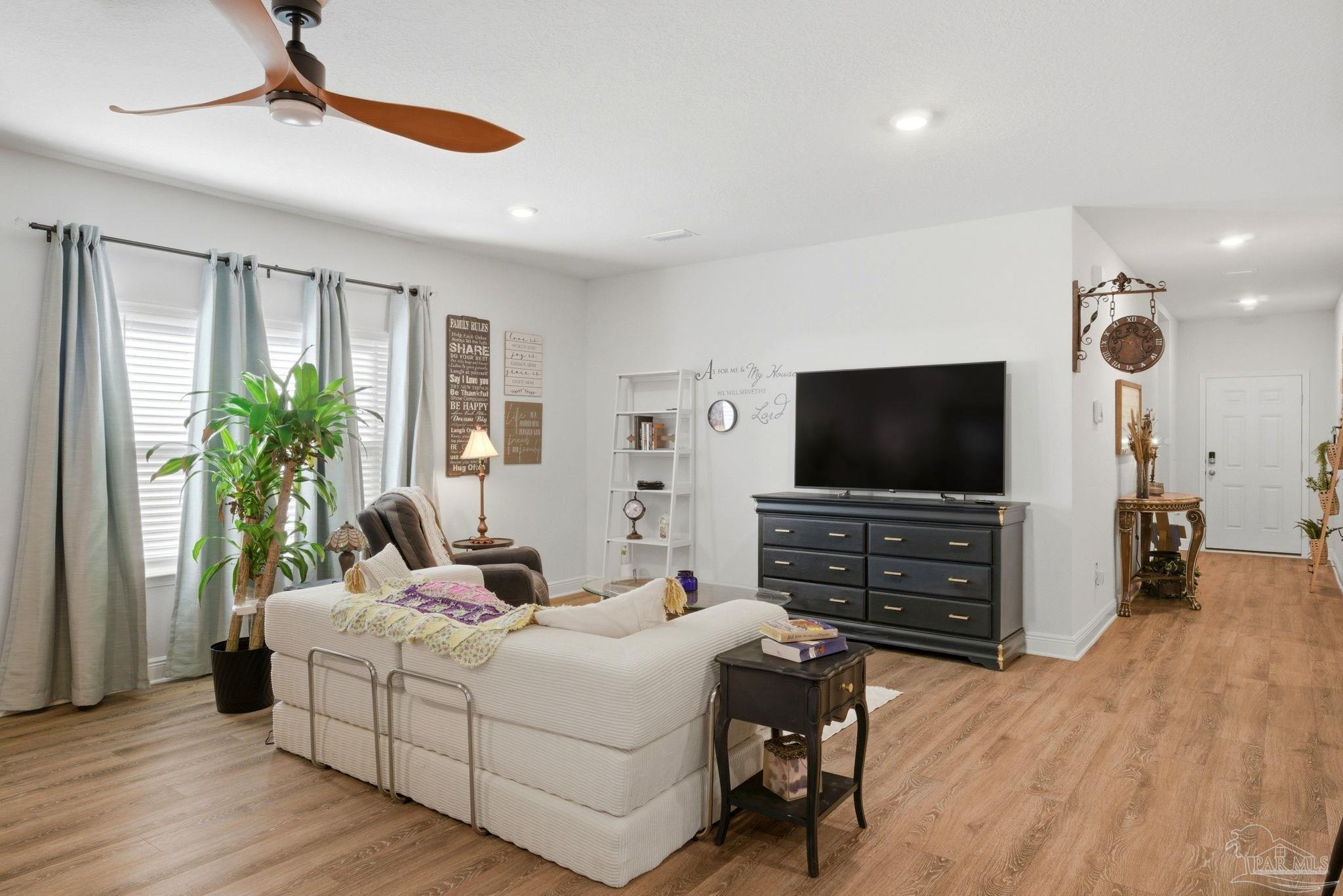 7829 Burnside Loop Pensacola, FL 32526 - Photo 9 of 34 a bedroom with furniture and a flat screen tv