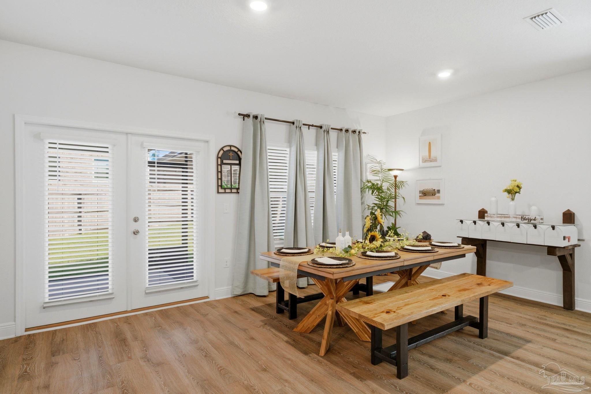 7829 Burnside Loop Pensacola, FL 32526 - Photo 10 of 34 a living room with furniture and wooden floor