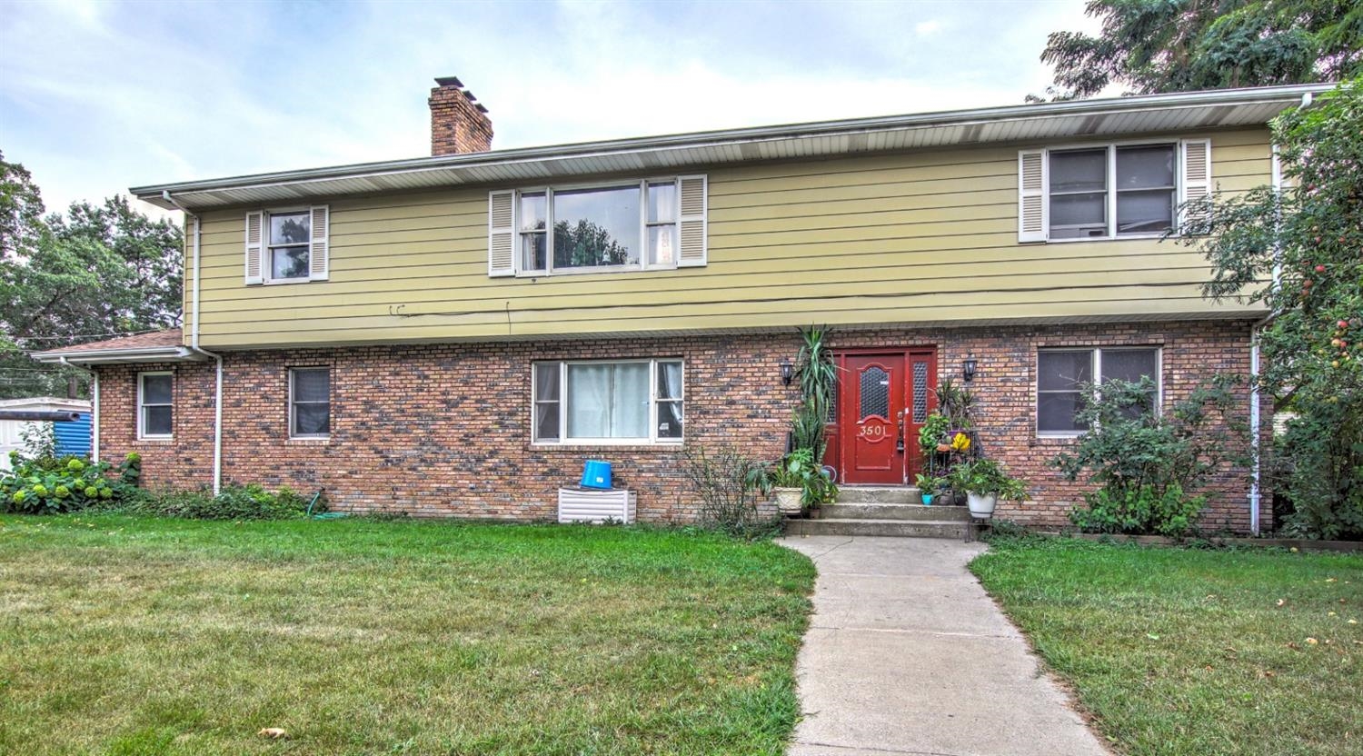 3501 West 40th Avenue Gary, IN 46408 - Photo 1 of 1 a front view of a house with garden