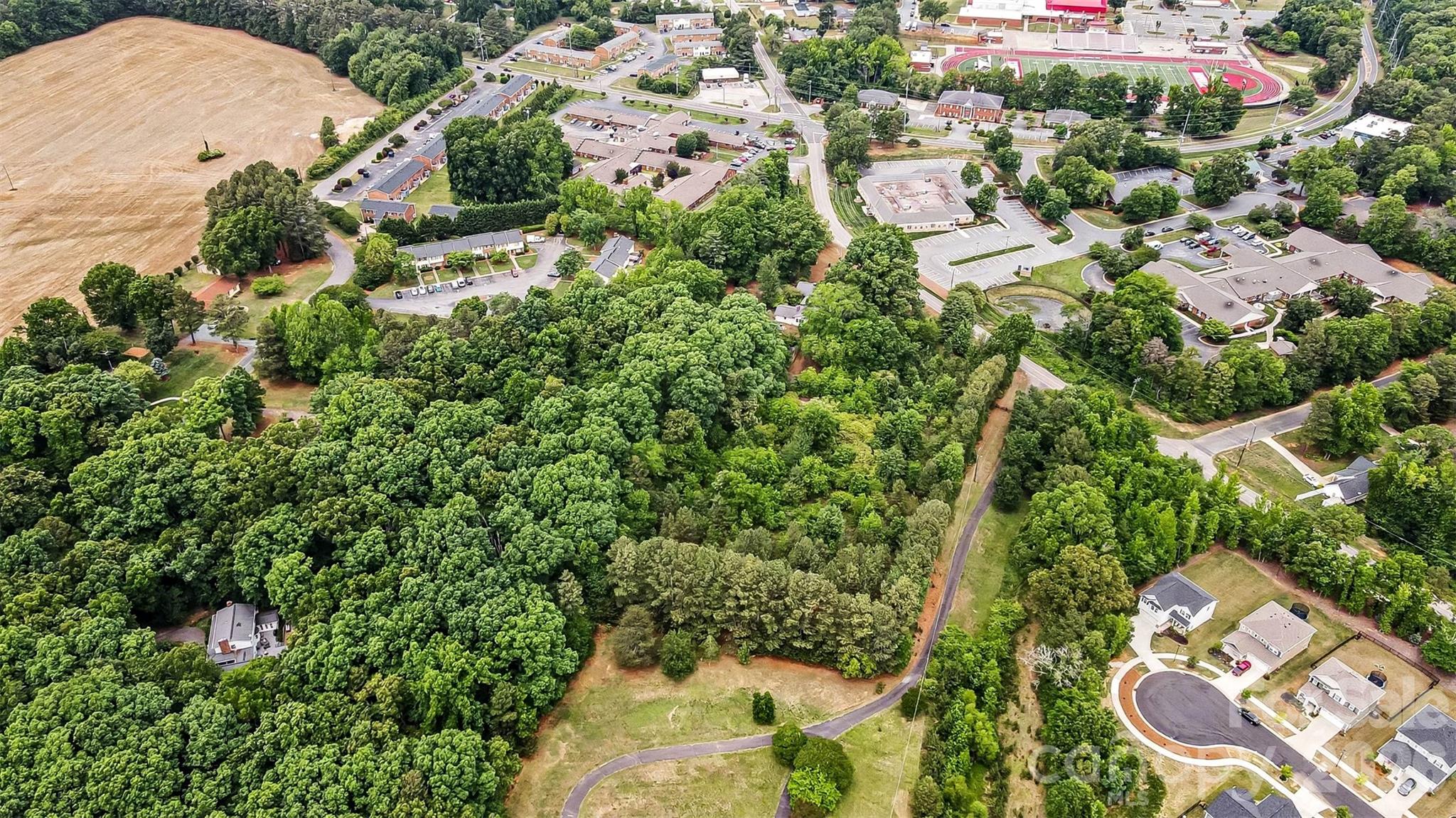1116 Medlin Road Monroe, NC 28112 - Photo 14 of 40 an aerial view of residential houses with outdoor space and trees all around