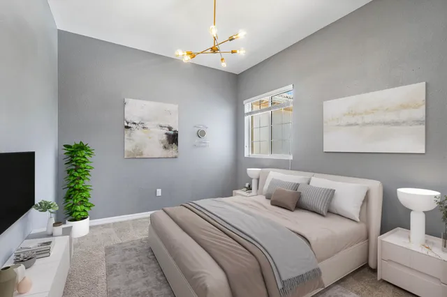 an empty room with windows and ceiling fan