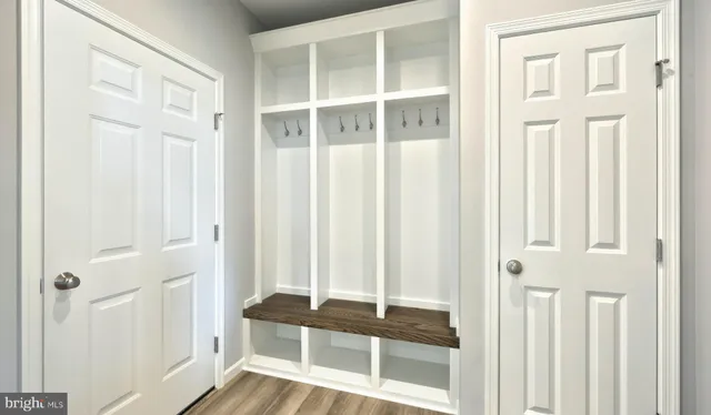 a view of a balcony with wooden floor and door