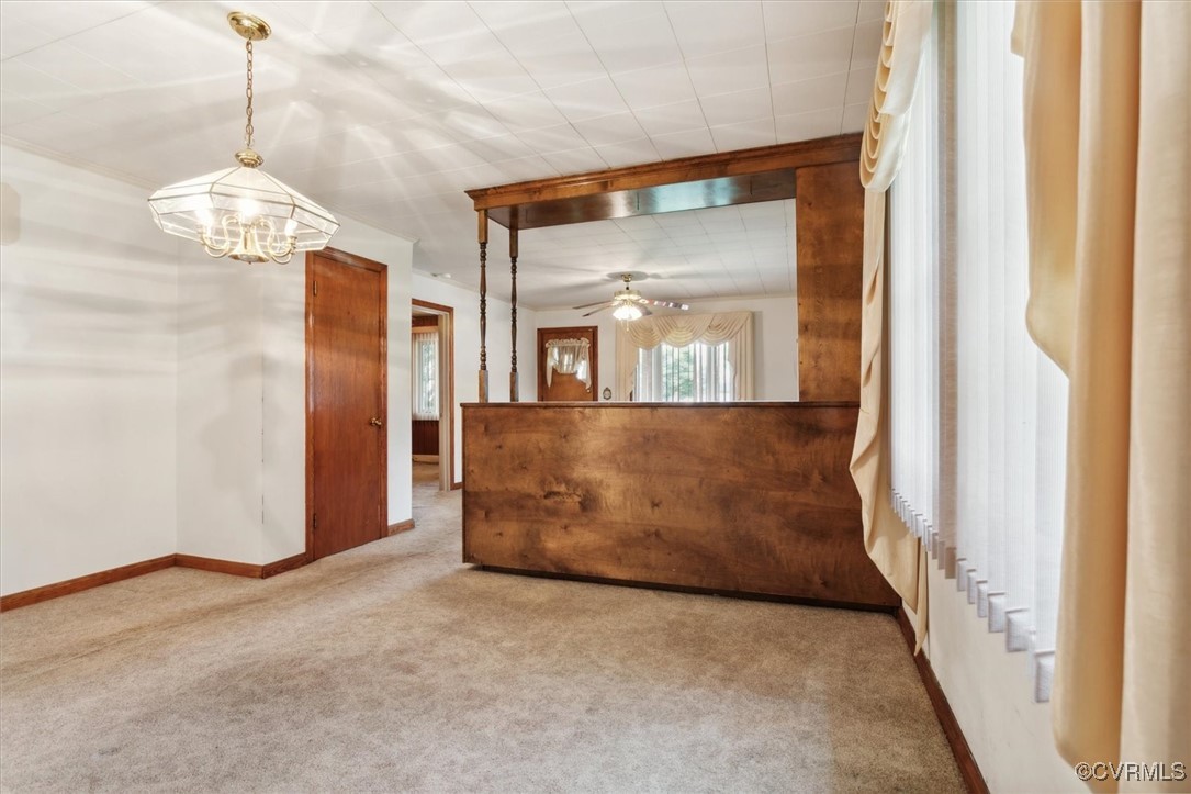 456 Queens Creek Road Williamsburg, VA 23185 - Photo 13 of 44 a view of a hallway with wooden floor and chandelier