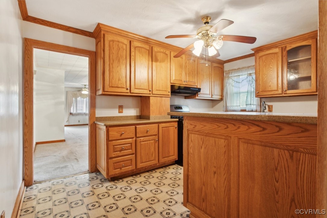 456 Queens Creek Road Williamsburg, VA 23185 - Photo 25 of 44 a kitchen with stainless steel appliances granite countertop a stove a sink and a refrigerator with wooden cabinets