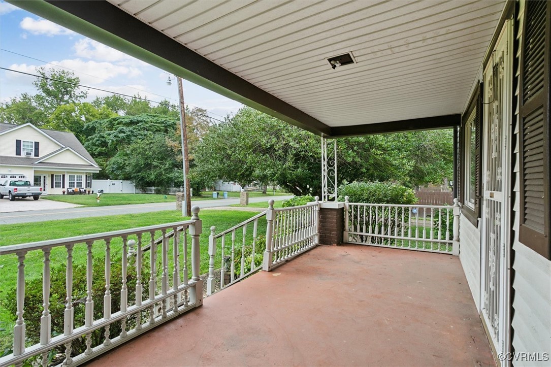 456 Queens Creek Road Williamsburg, VA 23185 - Photo 3 of 44 a view of a porch with wooden floor next to a yard