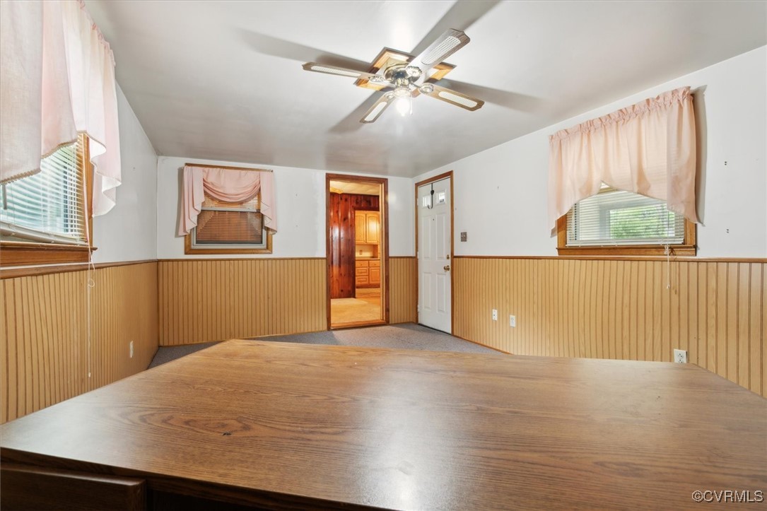 456 Queens Creek Road Williamsburg, VA 23185 - Photo 33 of 44 a view of a livingroom with wooden floor and a ceiling fan