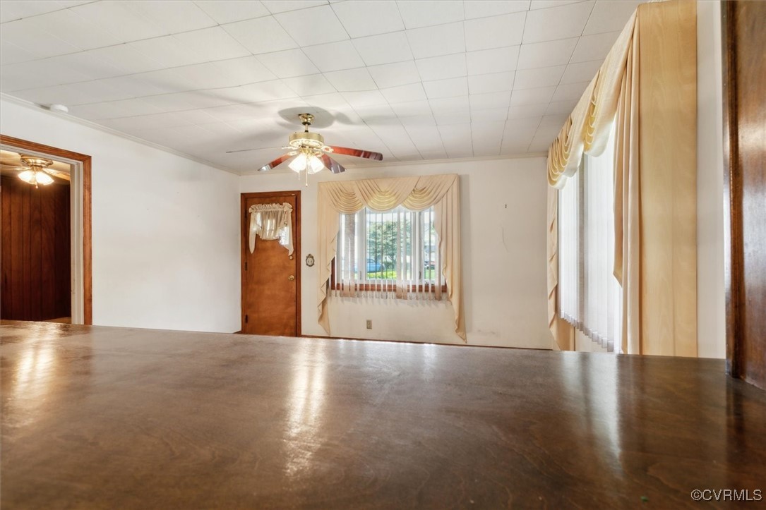 456 Queens Creek Road Williamsburg, VA 23185 - Photo 9 of 44 a view of an empty room with a window and wooden floor