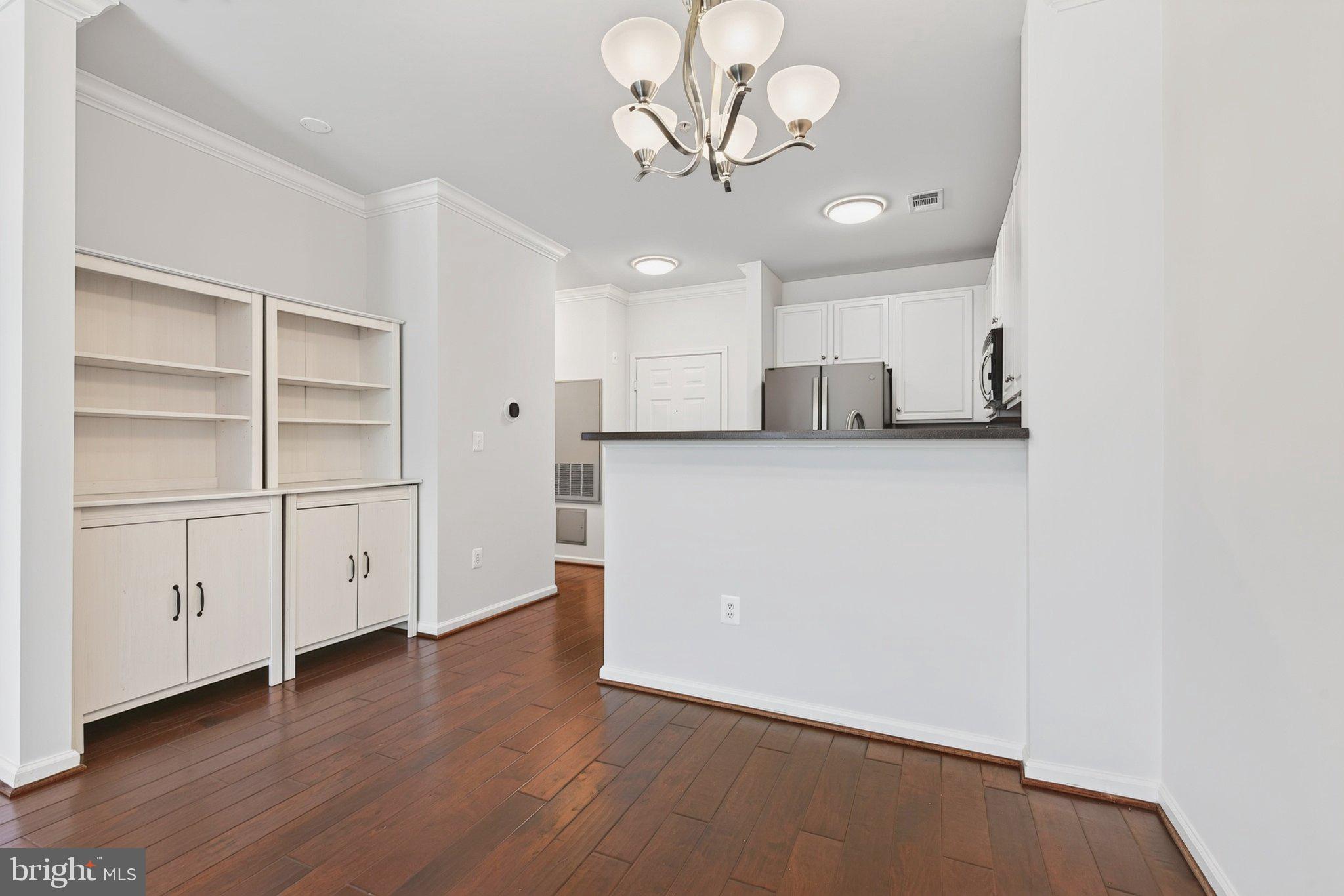 12001 Market Street, Unit 145 Reston, VA 20190 - Photo 8 of 46 Dining Area with Cabinets that Convey