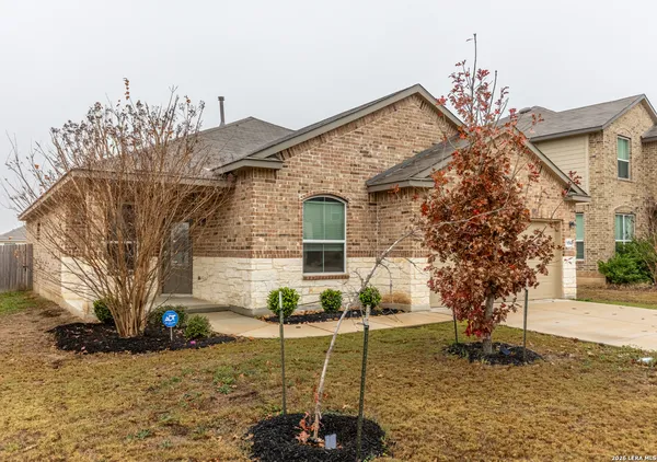 a view of a house with brick walls