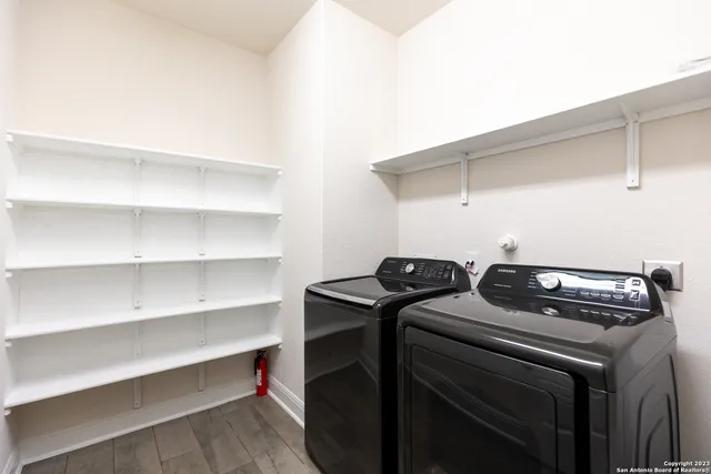 a utility room with washer and dryer