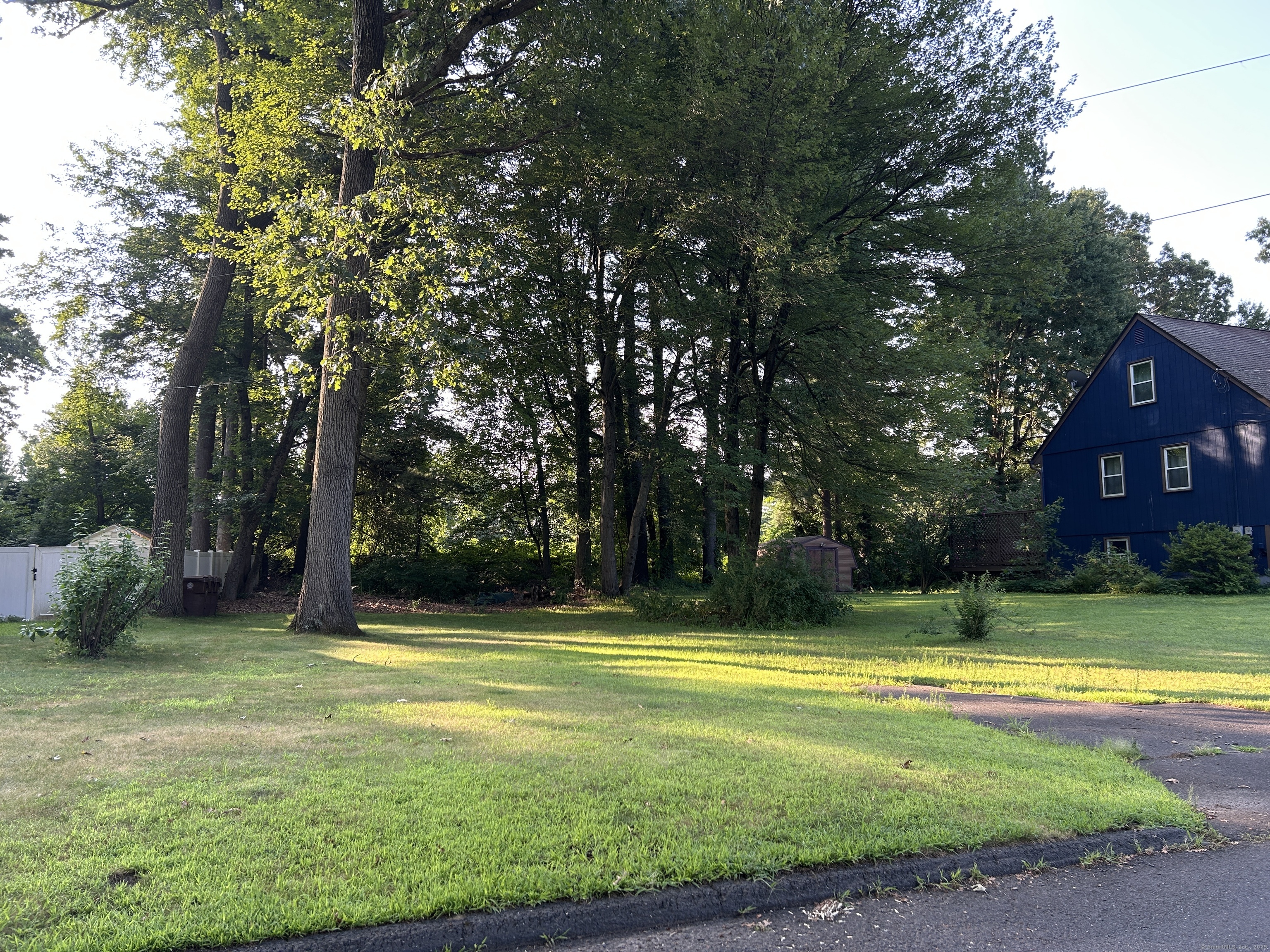 176 Cottage Road Enfield, CT 06082 - Photo 2 of 9 a view of a swimming pool in a yard with lawn chairs
