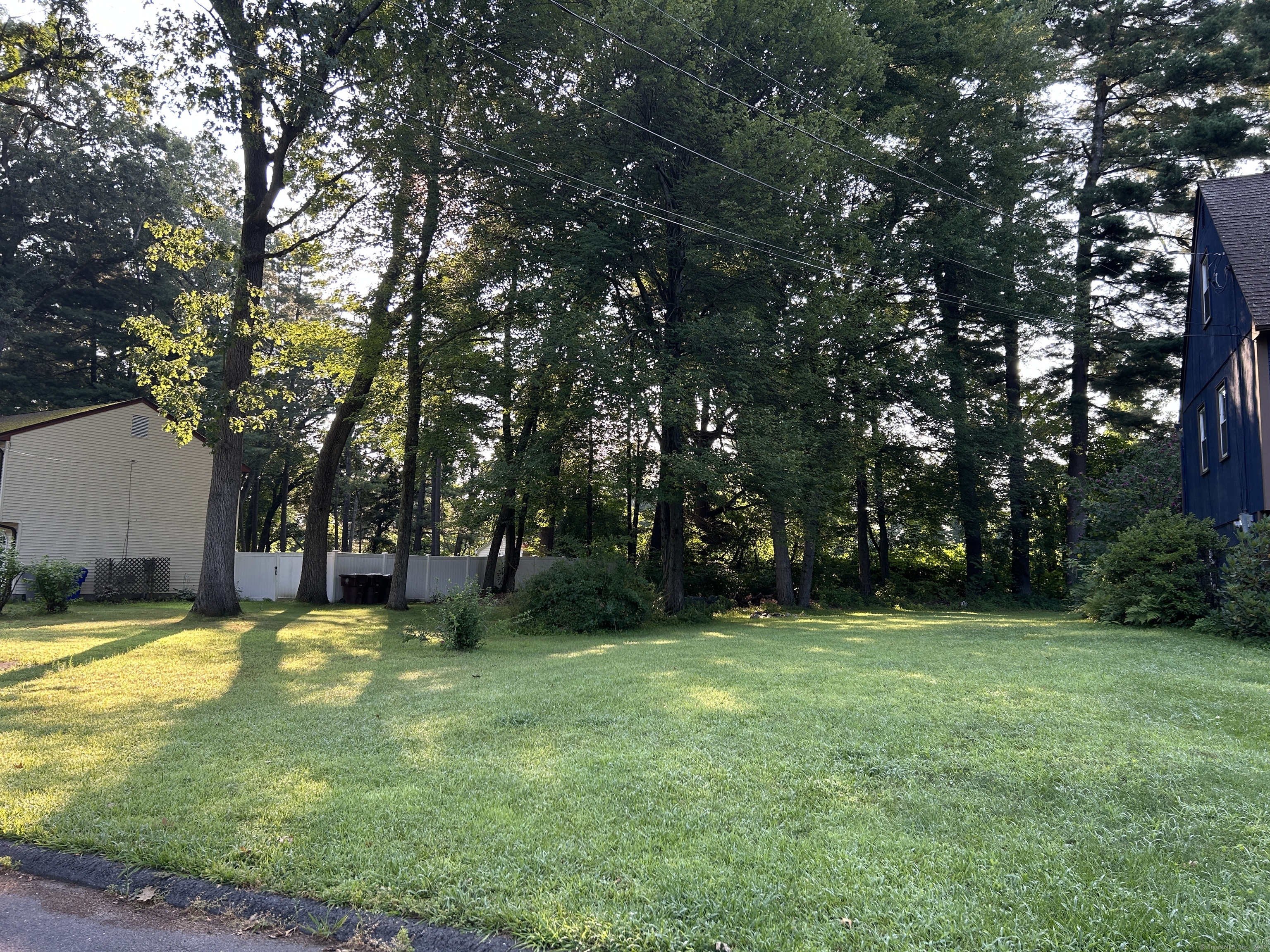176 Cottage Road Enfield, CT 06082 - Photo 4 of 9 a view of a swimming pool and trees in the background