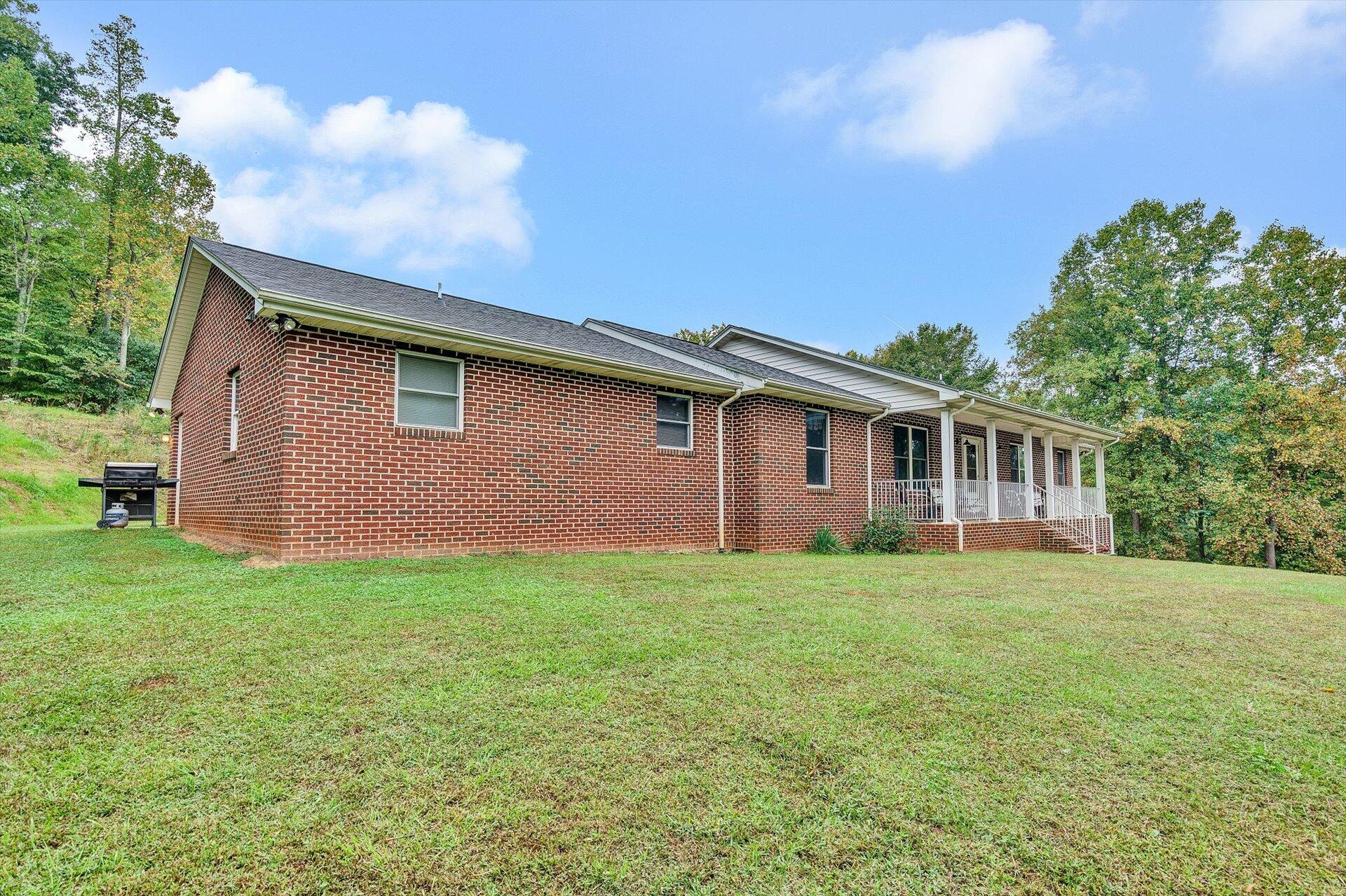 415 Eton Road Hardy, VA 24101 - Photo 2 of 44 a backyard of a house with lots of green space