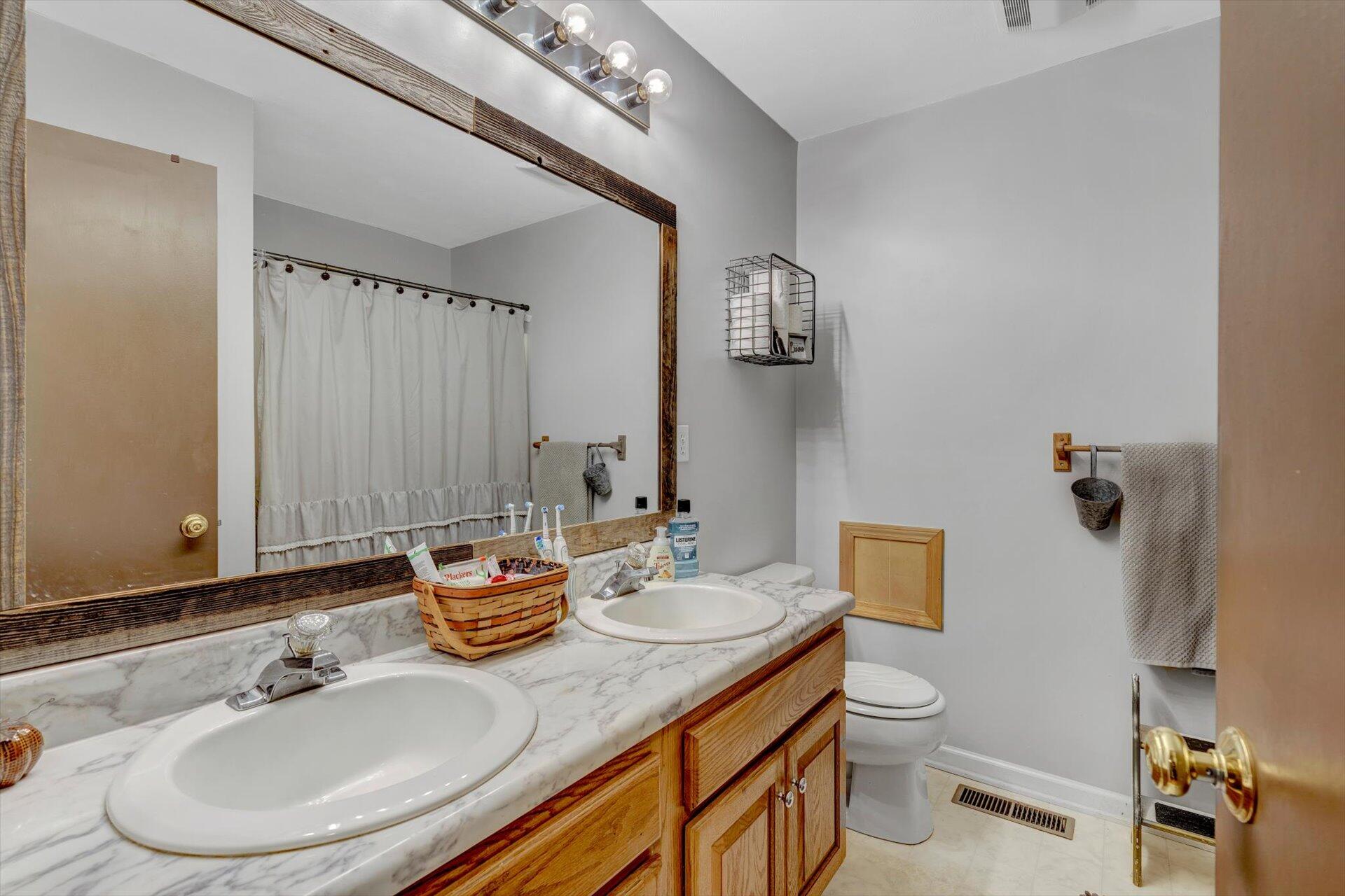 415 Eton Road Hardy, VA 24101 - Photo 11 of 44 a bathroom with a sink a toilet and mirror