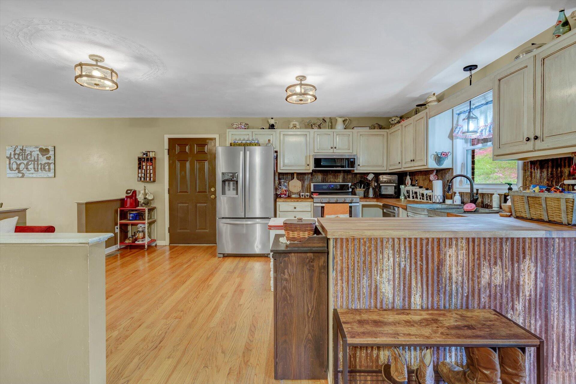 415 Eton Road Hardy, VA 24101 - Photo 14 of 44 a living room with stainless steel appliances lots of furniture and wooden floors