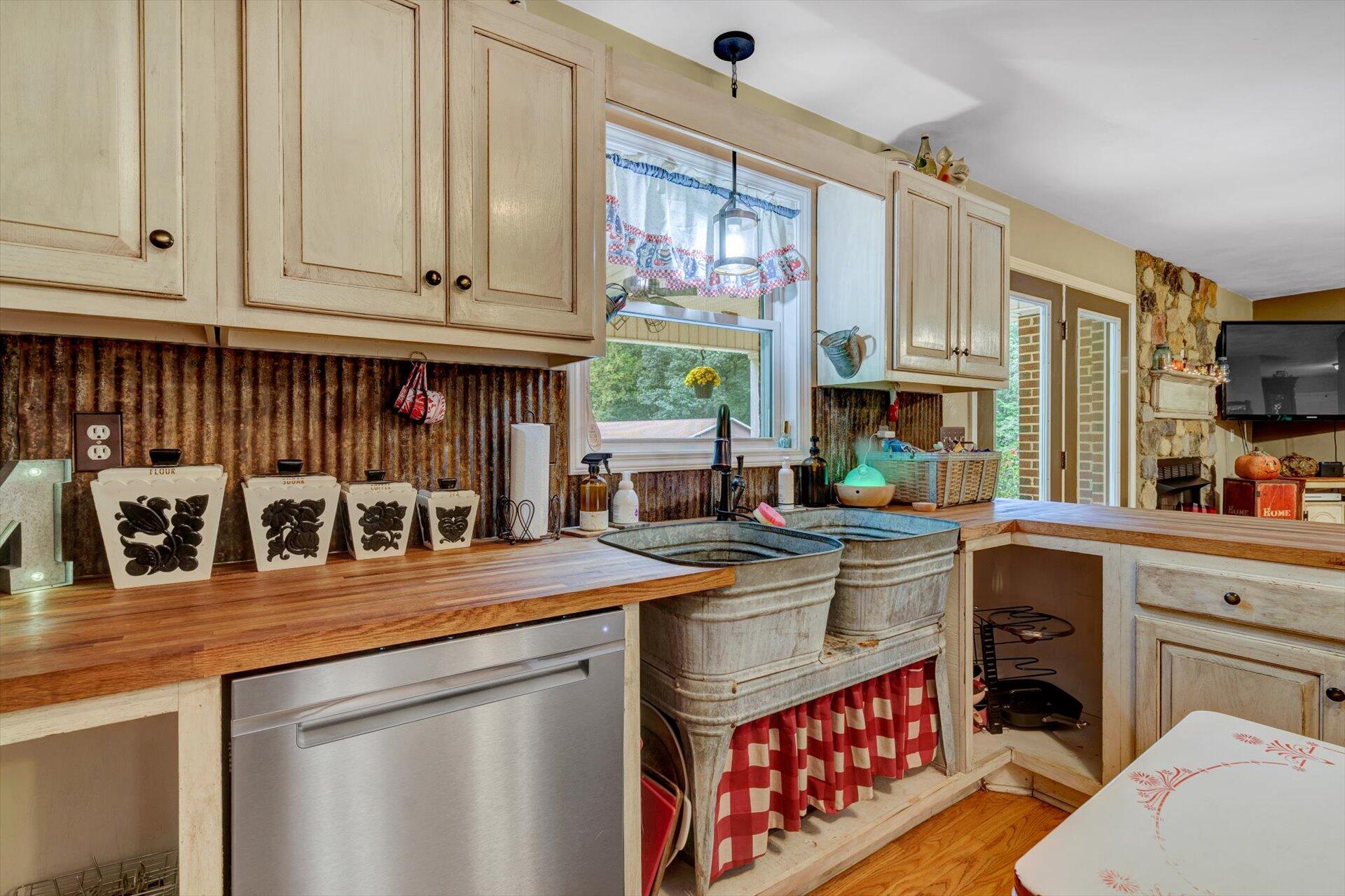 415 Eton Road Hardy, VA 24101 - Photo 16 of 44 a kitchen with stainless steel appliances granite countertop a stove and a sink