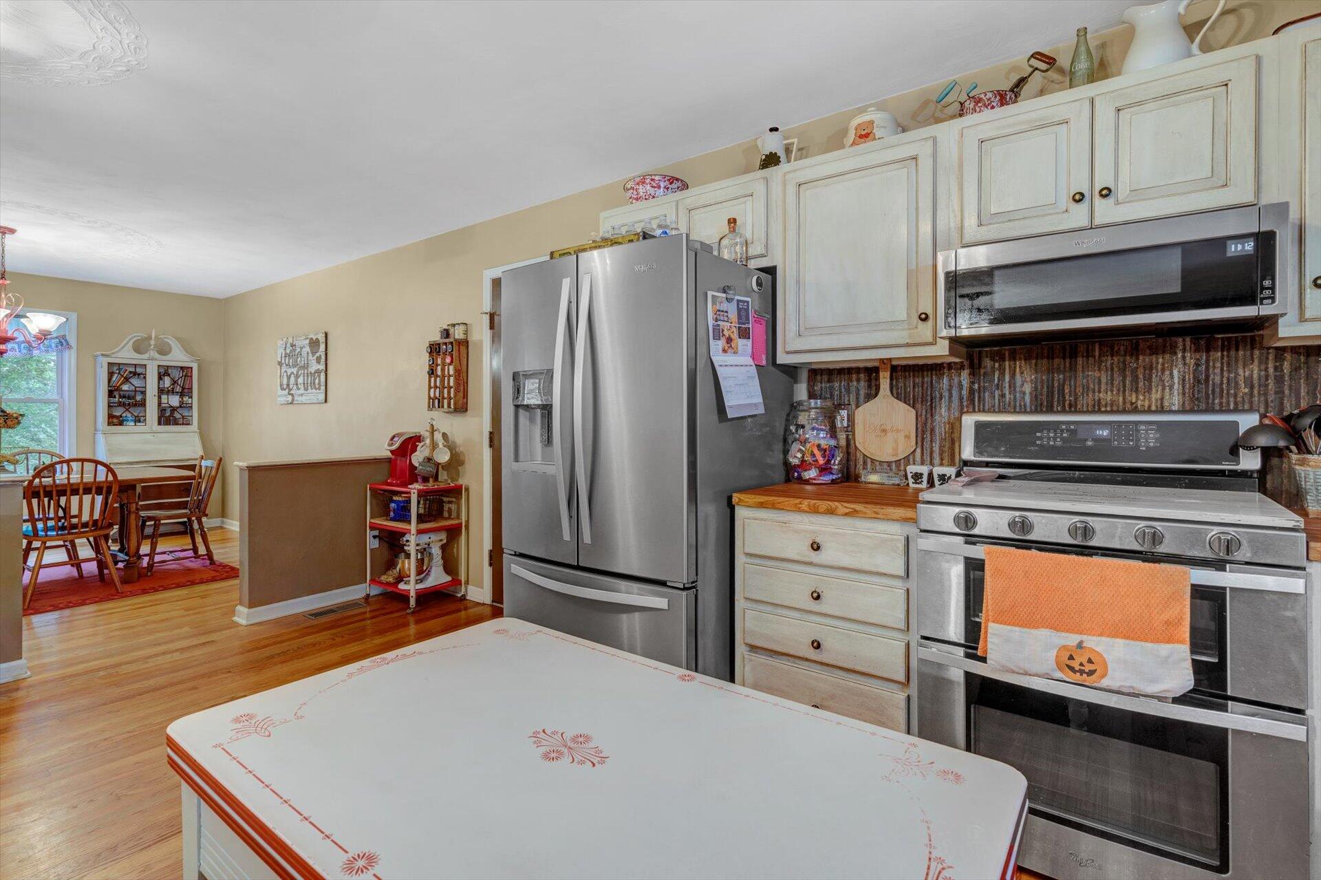 415 Eton Road Hardy, VA 24101 - Photo 17 of 44 a kitchen with refrigerator cabinets and wooden floor