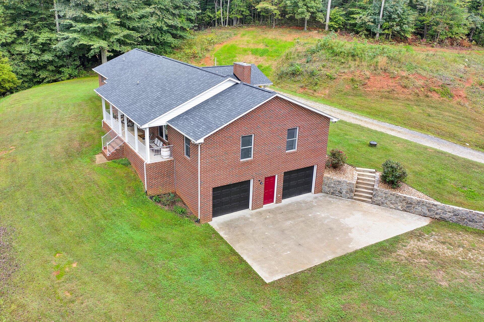 415 Eton Road Hardy, VA 24101 - Photo 3 of 44 a aerial view of a house with a yard table and chairs