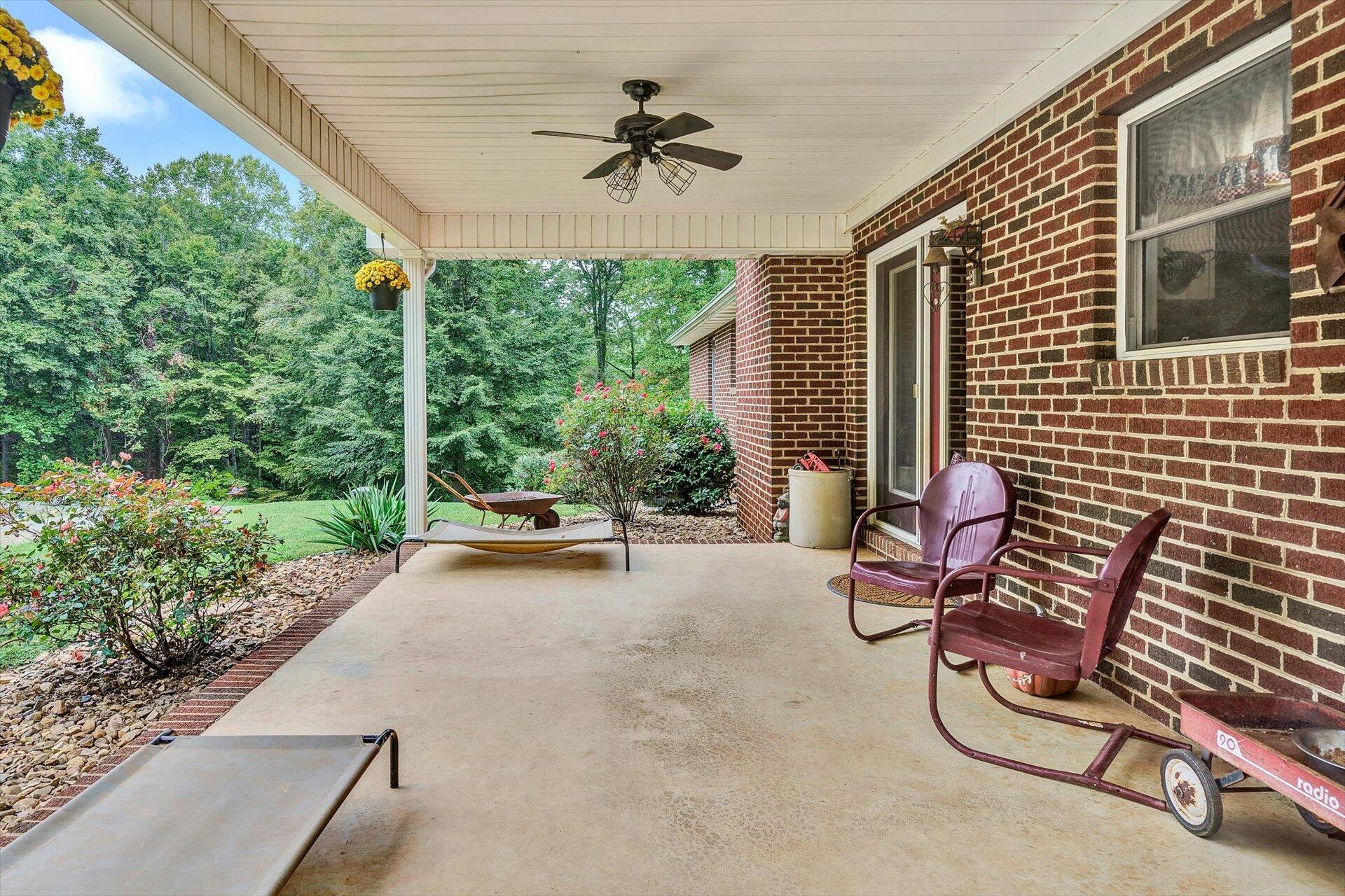 415 Eton Road Hardy, VA 24101 - Photo 21 of 44 a view of a patio with a table and chairs