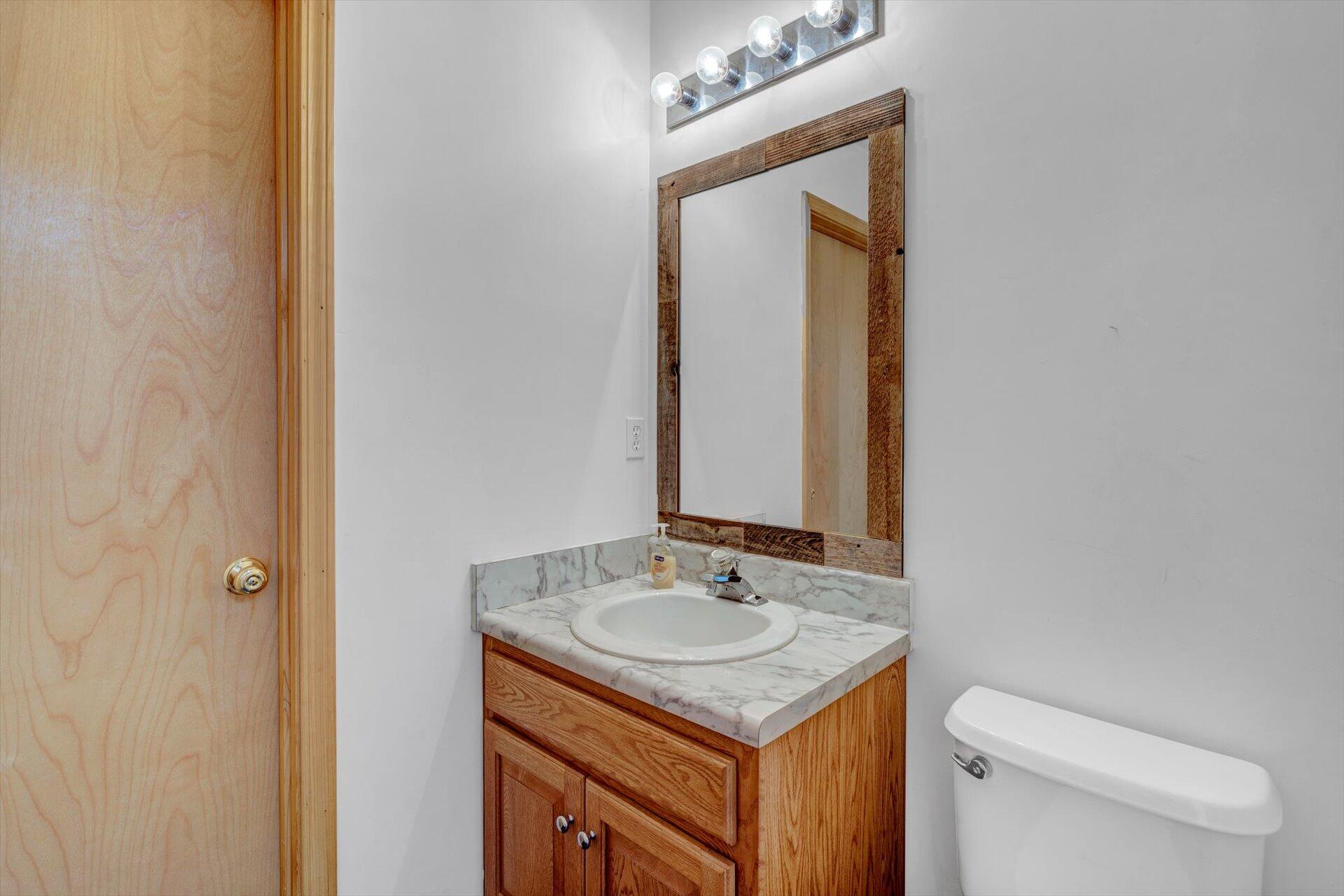 415 Eton Road Hardy, VA 24101 - Photo 26 of 44 a bathroom with a sink a toilet and mirror